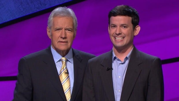Jeopardy host Alex Trebek poses with a winner.